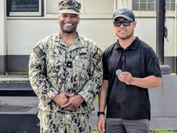 Admiral Tobias executes OICC MCM all hands and coin presentation