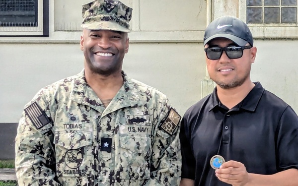 Admiral Tobias executes OICC MCM all hands and coin presentation