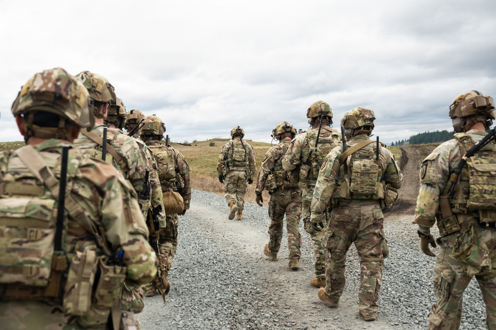 U.S. Soldiers execute team maneuvers during live fire training
