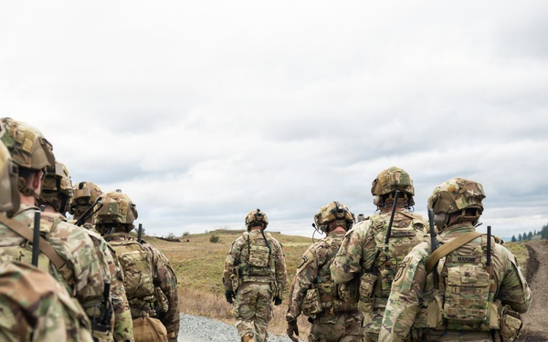 U.S. Soldiers execute team maneuvers during live fire training
