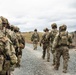 U.S. Soldiers execute team maneuvers during live fire training