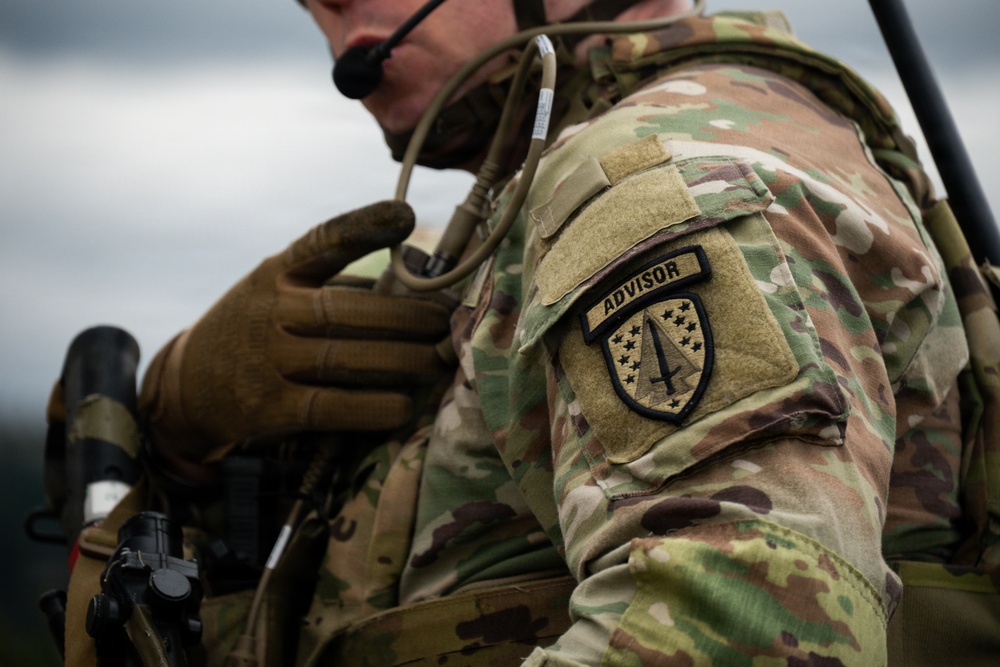 U.S. Soldiers execute team maneuvers during live fire training