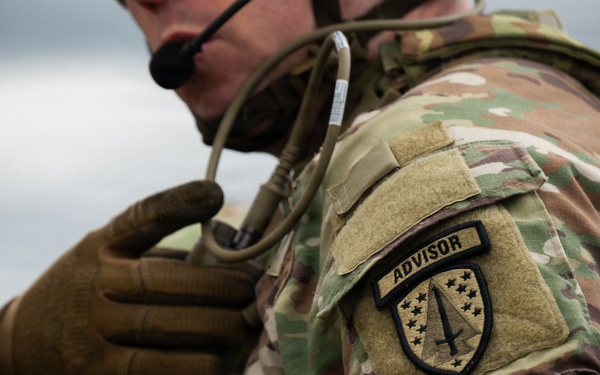 U.S. Soldiers execute team maneuvers during live fire training