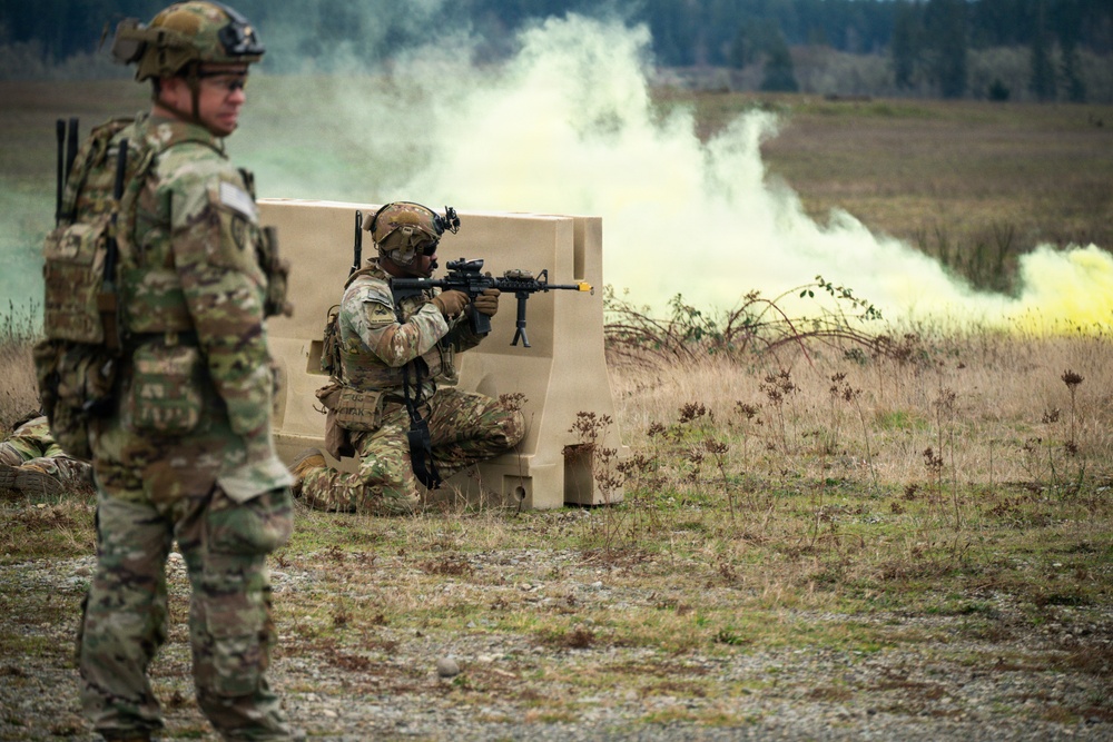 U.S. Soldiers execute team maneuvers during live fire training