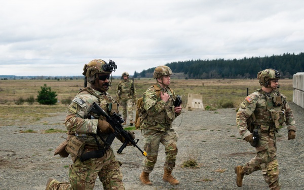 U.S. Soldiers execute team maneuvers during live fire training