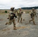 U.S. Soldiers execute team maneuvers during live fire training