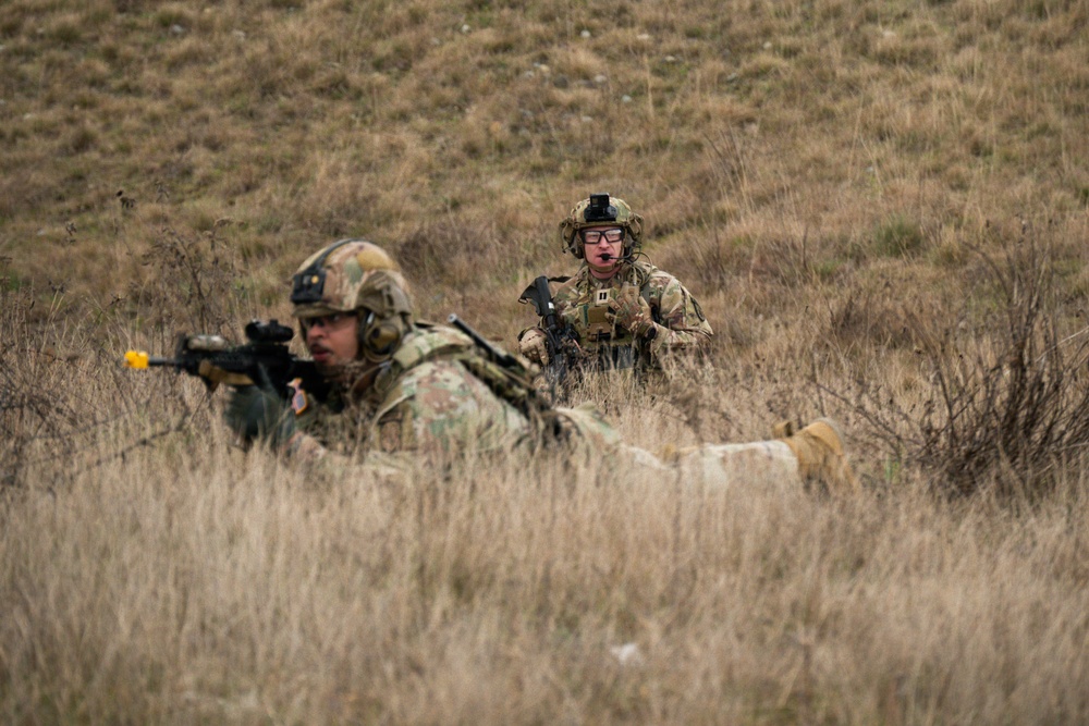 U.S. Soldiers execute team maneuvers during live fire training