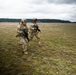 U.S. Soldiers execute team maneuvers during live fire training
