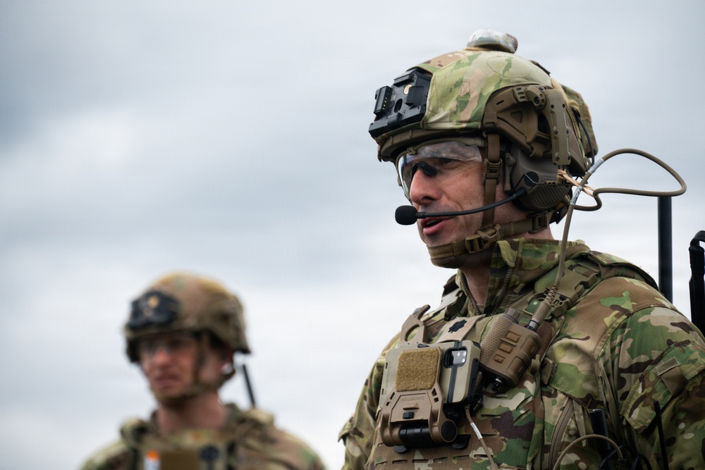 U.S. Soldiers execute team maneuvers during live fire training