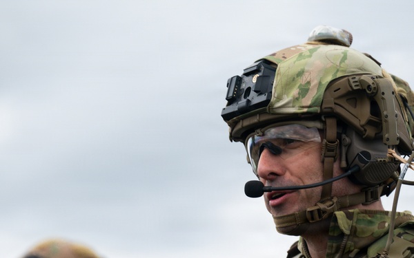 U.S. Soldiers execute team maneuvers during live fire training