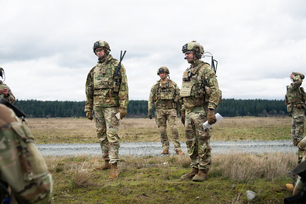 U.S. Soldiers execute team maneuvers during live fire training
