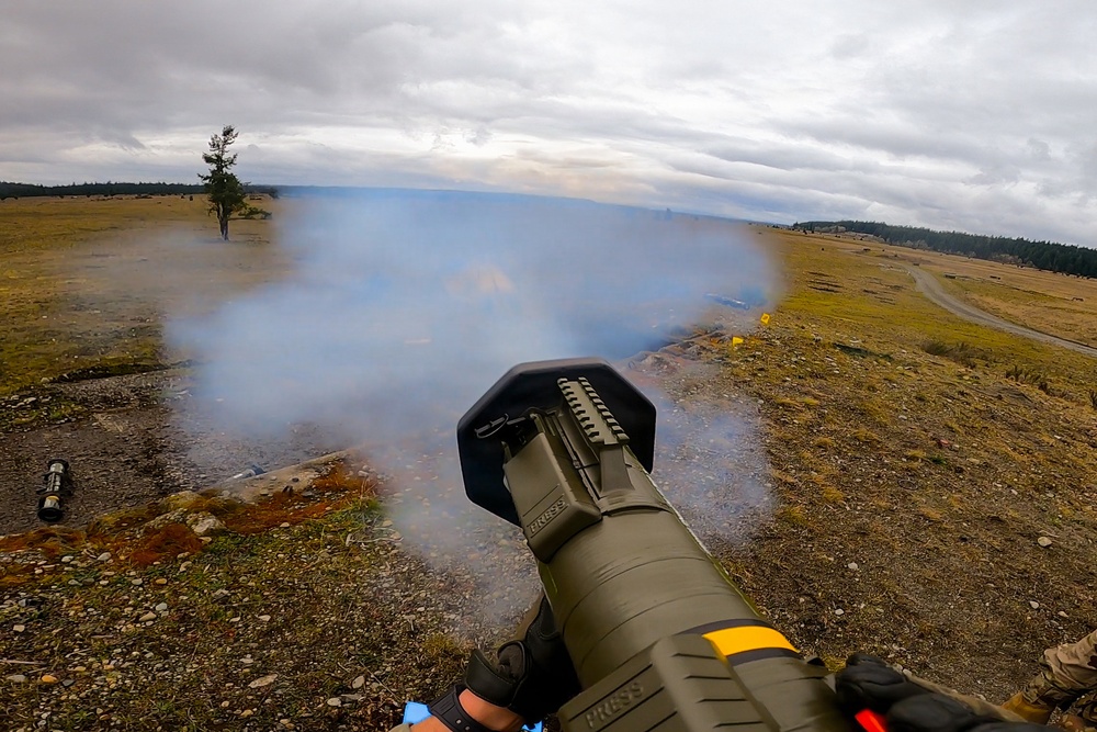 U.S. Soldiers execute team maneuvers during live fire training