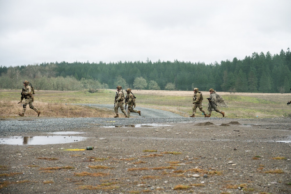 U.S. Soldiers execute team maneuvers during live fire training