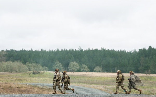 U.S. Soldiers execute team maneuvers during live fire training