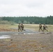 U.S. Soldiers execute team maneuvers during live fire training