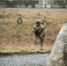 U.S. Soldiers execute team maneuvers during live fire training