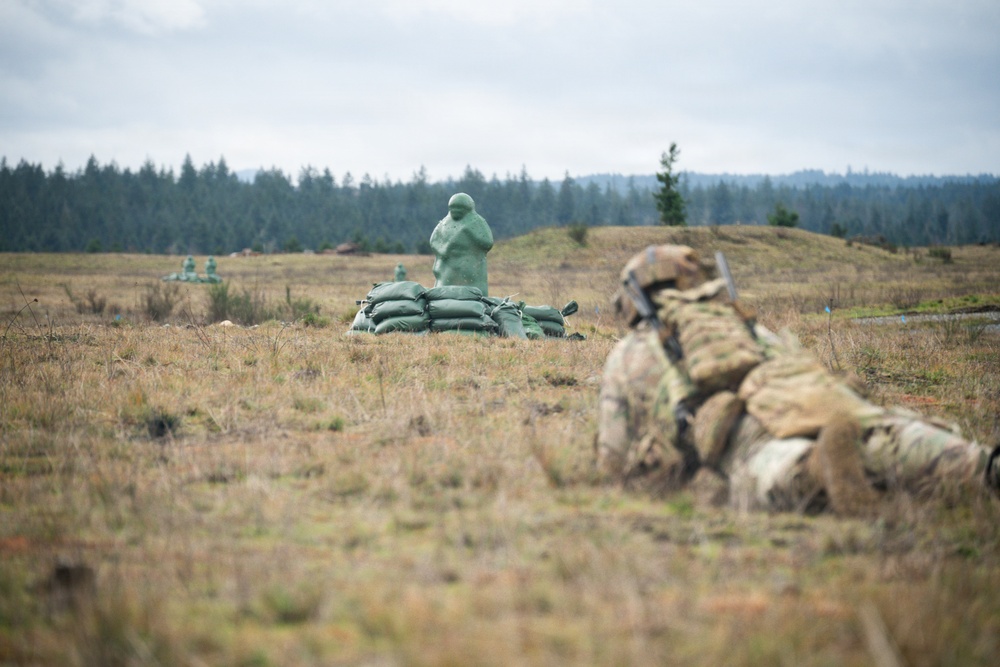 U.S. Soldiers execute team maneuvers during live fire training