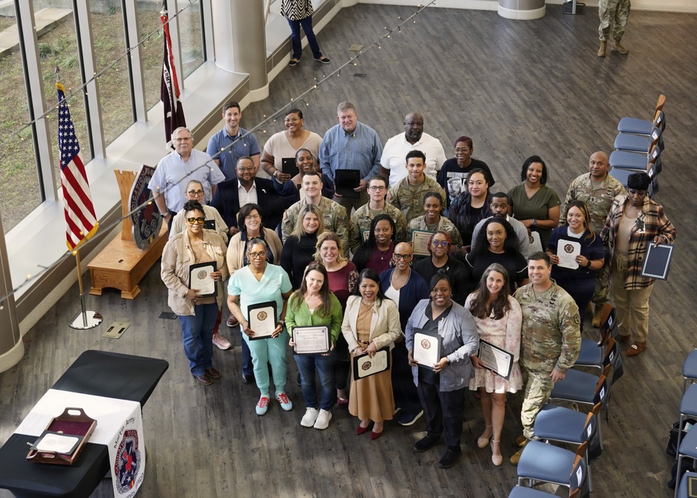 Soldiers and civilian staff from Martin Army Community Hospital are recognized during the hospital’s quarterly awards ceremony