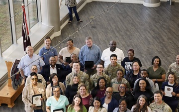 Soldiers and civilian staff from Martin Army Community Hospital are recognized during the hospital’s quarterly awards ceremony