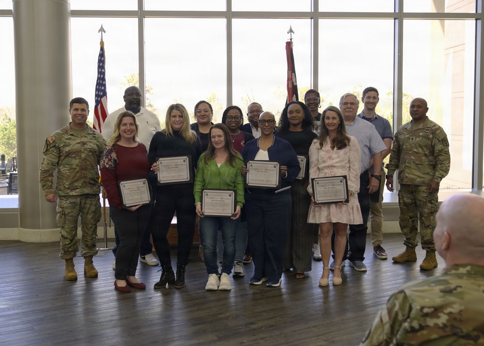 Soldiers and civilian staff from Martin Army Community Hospital are recognized during the hospital’s quarterly awards ceremony