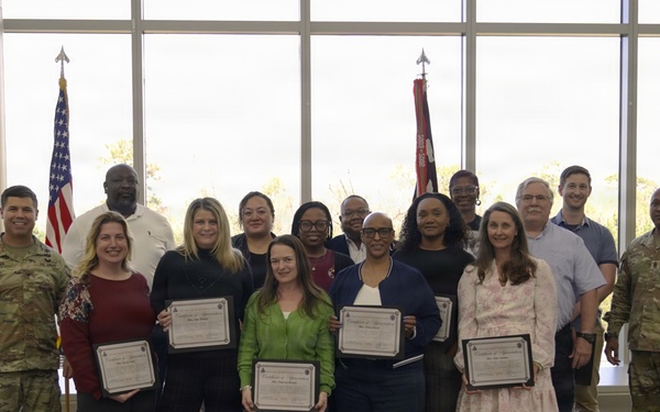 Soldiers and civilian staff from Martin Army Community Hospital are recognized during the hospital’s quarterly awards ceremony