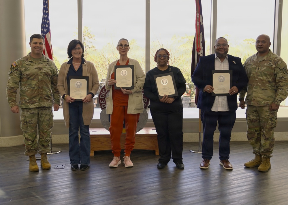 Soldiers and civilian staff from Martin Army Community Hospital are recognized during the hospital’s quarterly awards ceremony