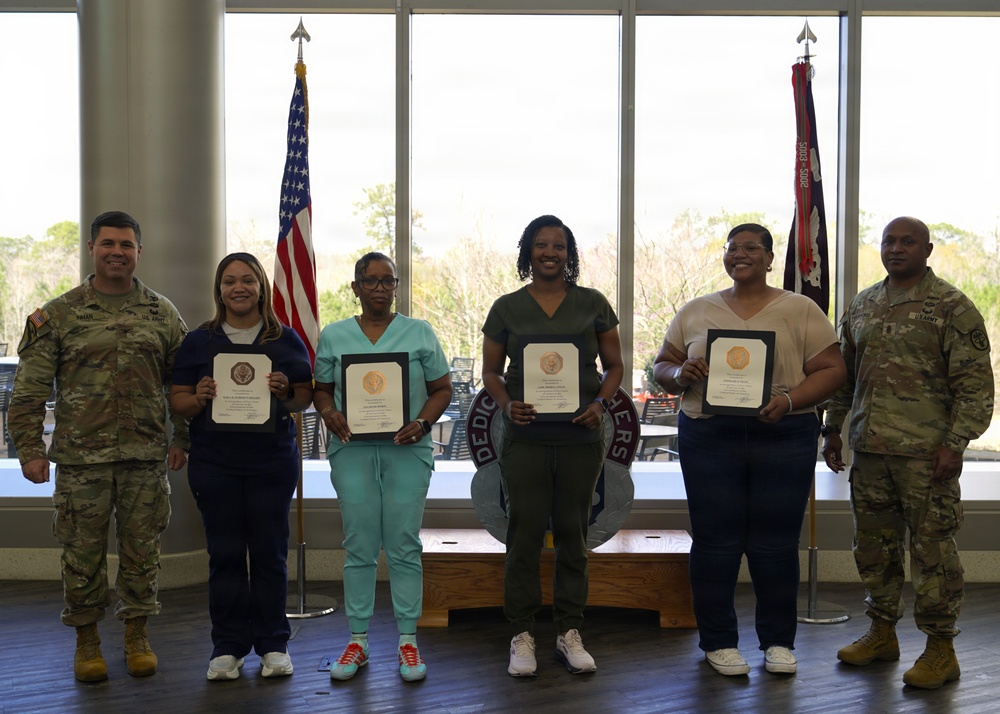 Soldiers and civilian staff from Martin Army Community Hospital are recognized during the hospital’s quarterly awards ceremony