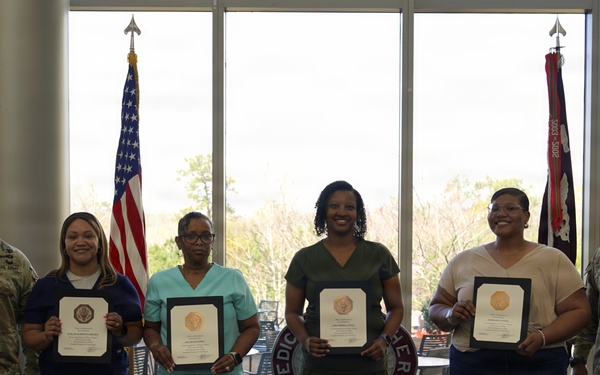 Soldiers and civilian staff from Martin Army Community Hospital are recognized during the hospital’s quarterly awards ceremony