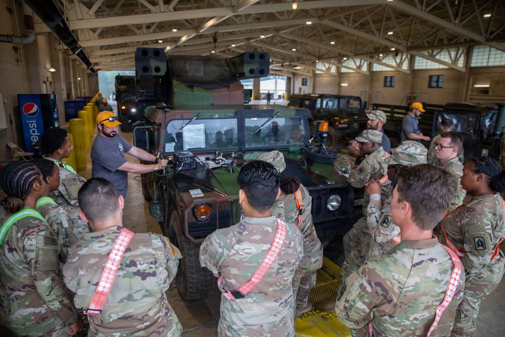 3-265 Air Defense Artillery Soldiers Install MILES on Vehicles at JRTC
