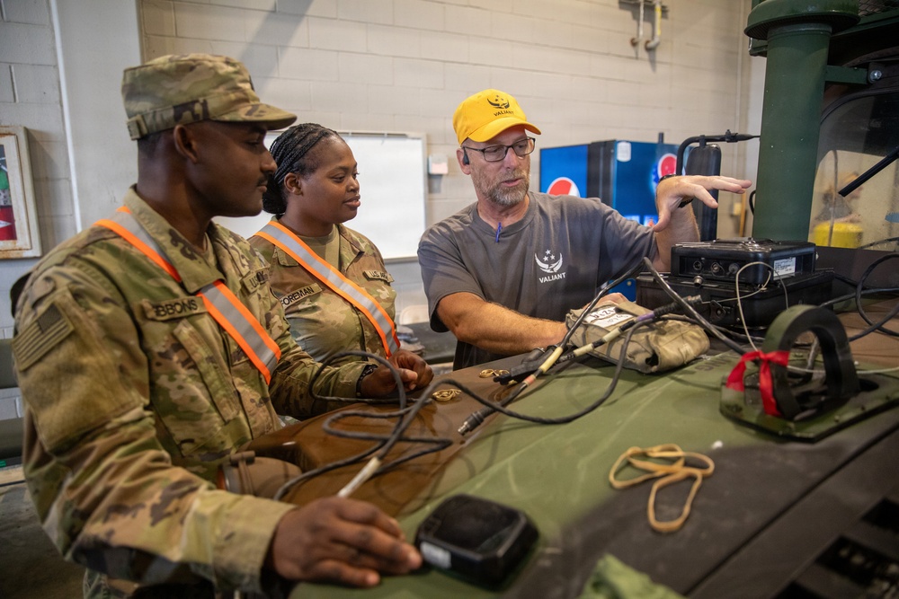 3-265 Air Defense Artillery Soldiers Install MILES on Vehicles at JRTC