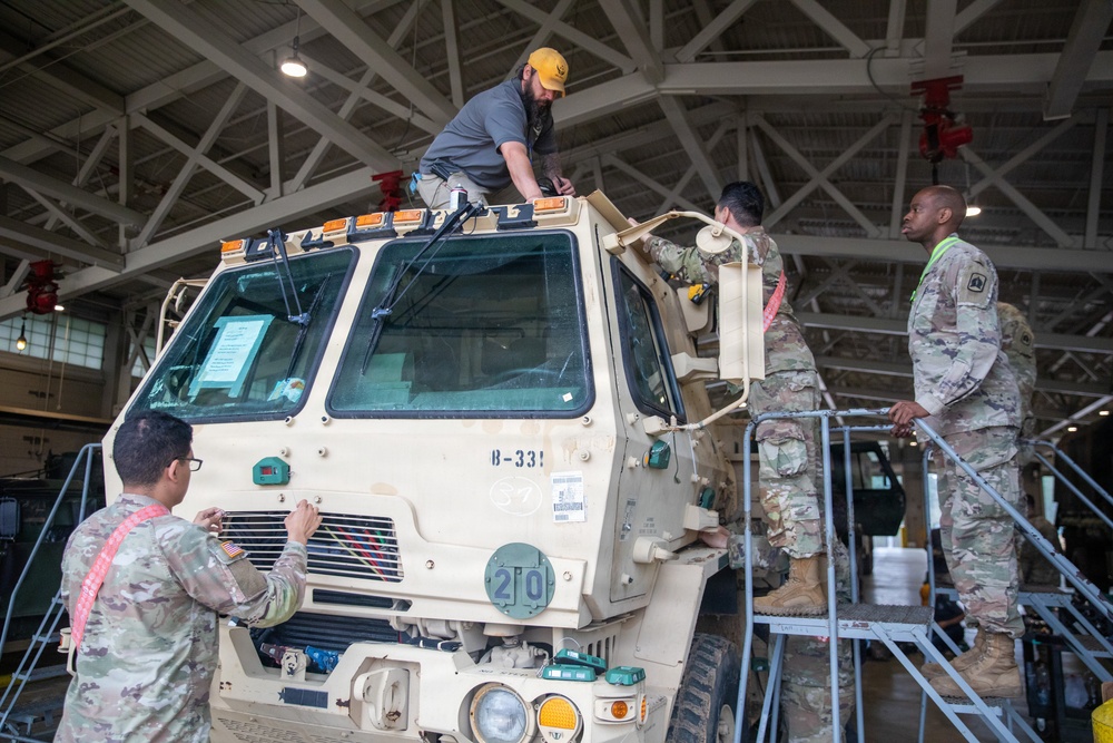 3-265 Air Defense Artillery Soldiers Install MILES on Vehicles at JRTC