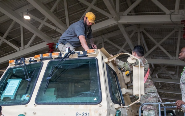 3-265 Air Defense Artillery Soldiers Install MILES on Vehicles at JRTC