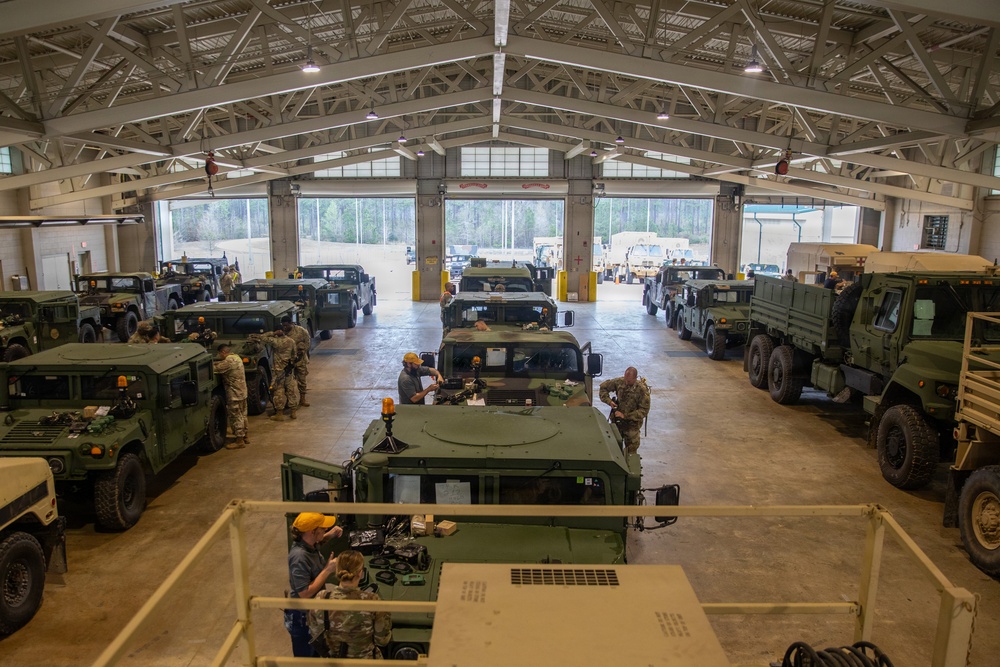 3-265 Air Defense Artillery Soldiers Install MILES on Vehicles at JRTC