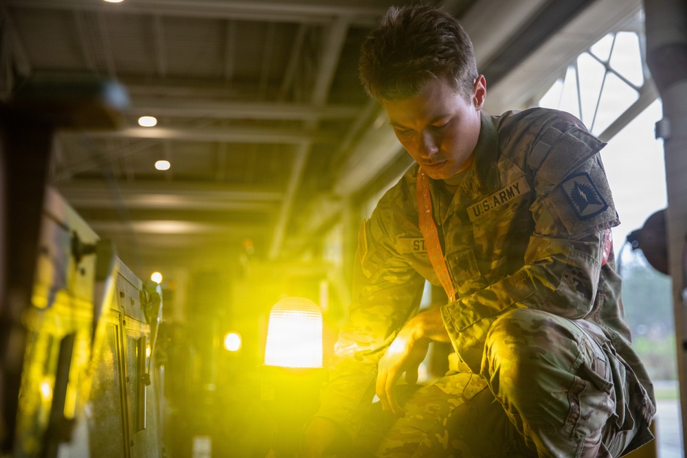 3-265 Air Defense Artillery Soldiers Install MILES on Vehicles at JRTC