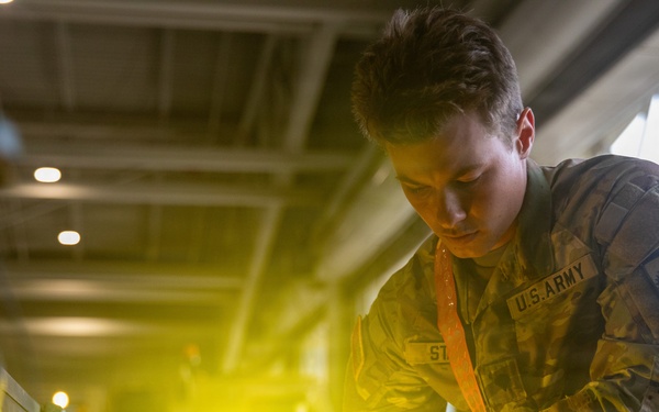 3-265 Air Defense Artillery Soldiers Install MILES on Vehicles at JRTC