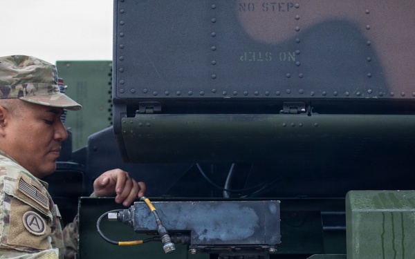 3-265 Air Defense Artillery Soldiers Install MILES on Vehicles at JRTC
