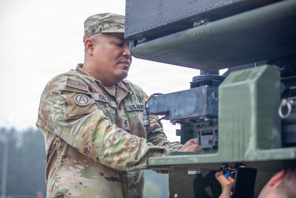 3-265 Air Defense Artillery Soldiers Install MILES on Vehicles at JRTC