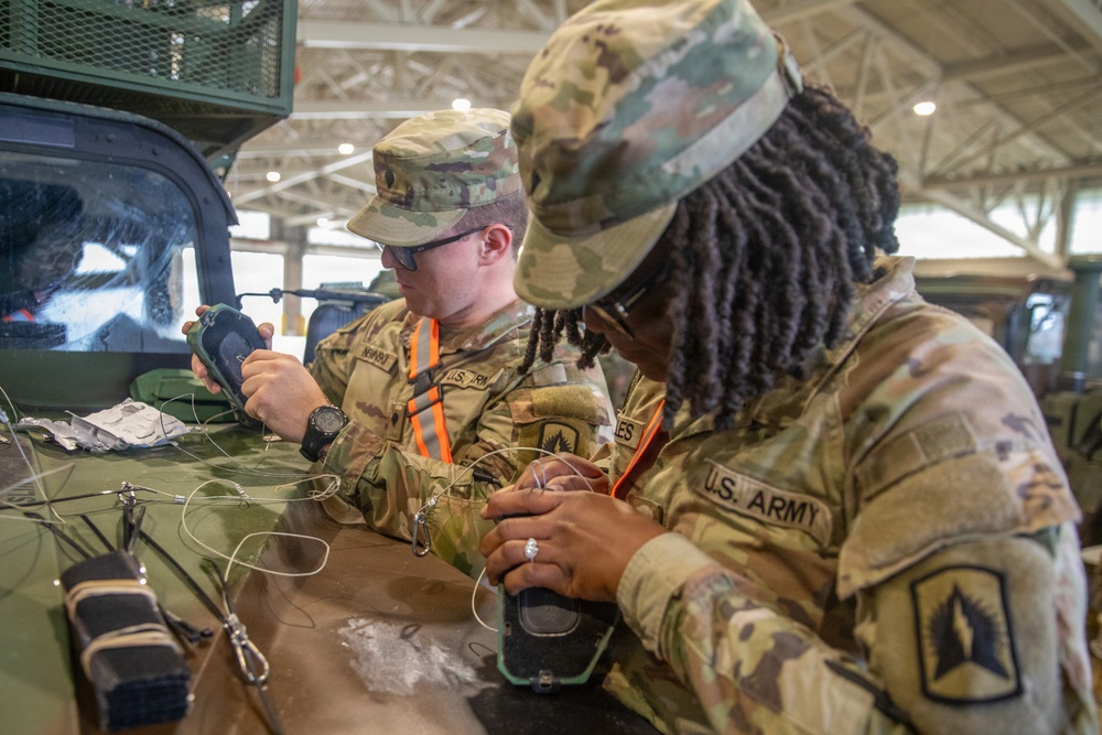 3-265 Air Defense Artillery Soldiers Install MILES on Vehicles at JRTC