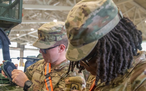 3-265 Air Defense Artillery Soldiers Install MILES on Vehicles at JRTC