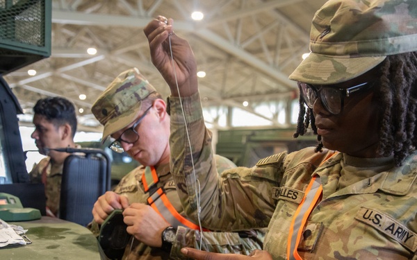 3-265 Air Defense Artillery Soldiers Install MILES on Vehicles at JRTC