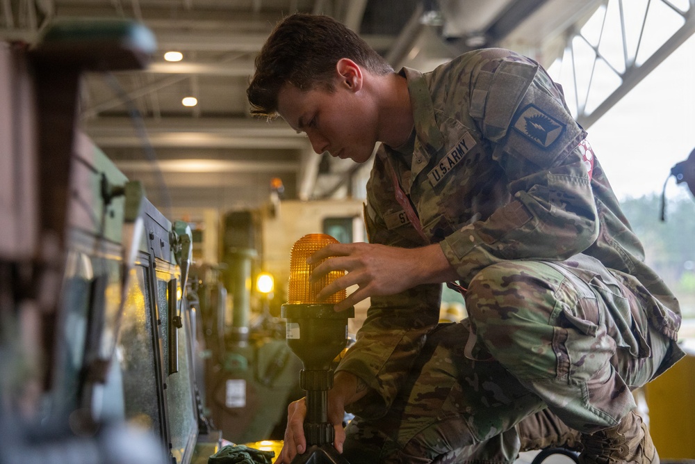 3-265 Air Defense Artillery Soldiers Install MILES on Vehicles at JRTC