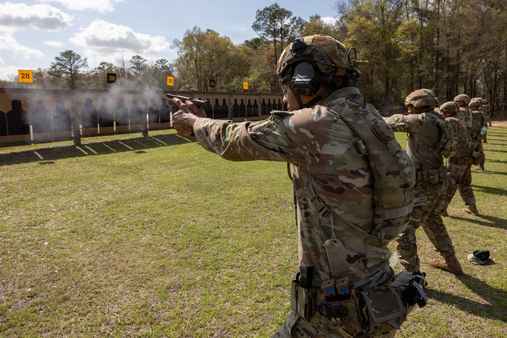 OC/T Focuses on Target while Shooting M17 at All Army