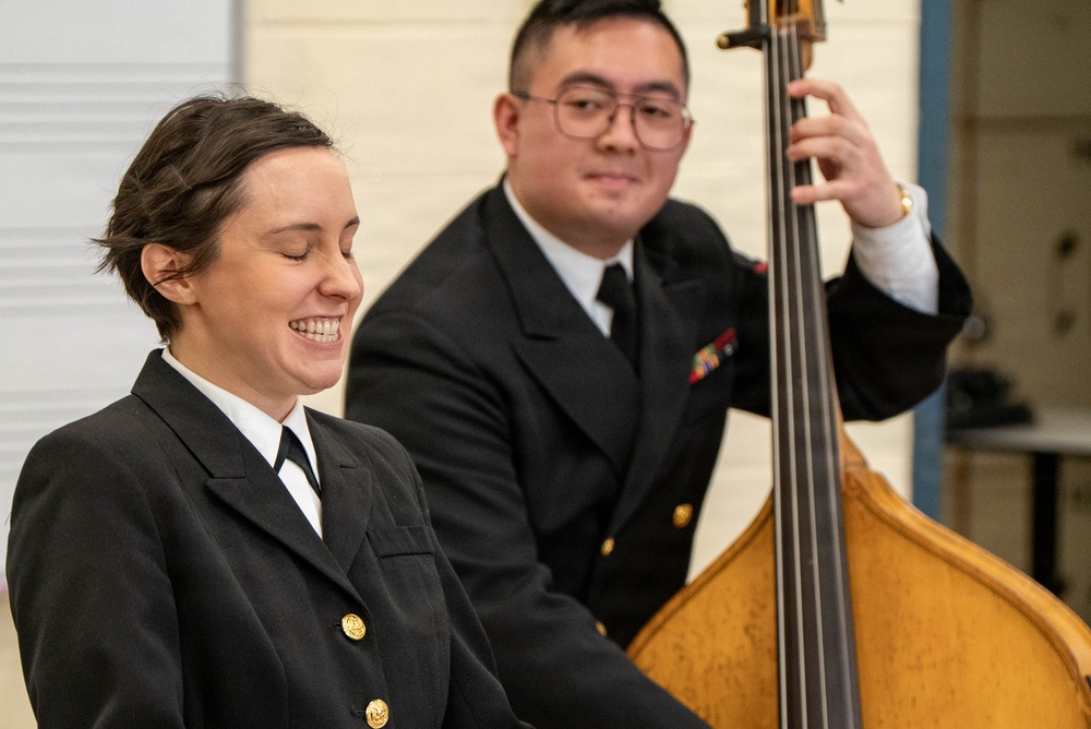 Musician 1st Class Alissa Suver of the US Navy Band Sea Chanters perform at Schalmont High School