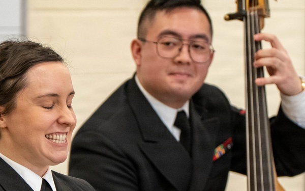 Musician 1st Class Alissa Suver of the US Navy Band Sea Chanters perform at Schalmont High School