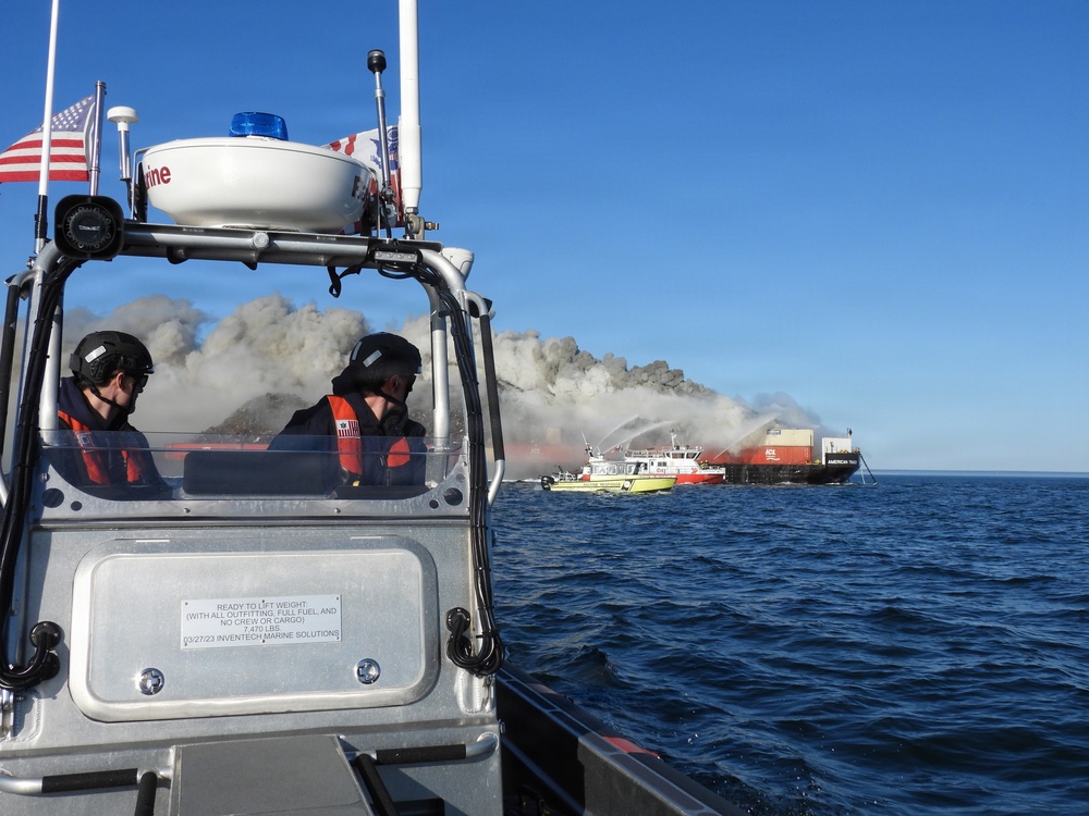 Coast Guard Cutter Lawrence Lawson maintains safety zone during Delaware Bay barge fire