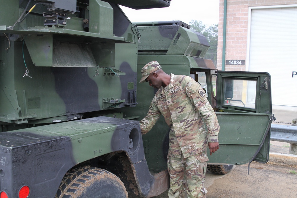 3-265th Air Defense Artillery Regiment Soldiers prepare installation of MILES gear