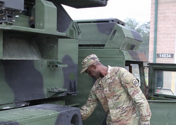 3-265th Air Defense Artillery Regiment Soldiers prepare installation of MILES gear