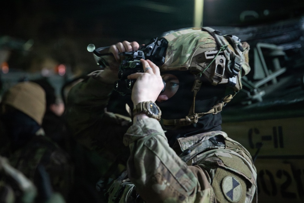Soldier checks AN/PVS-31C Binocular Night Vision Device