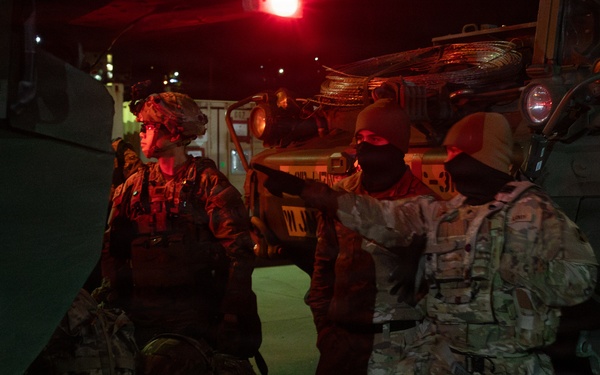 Soldiers load their rucks into M1126 Stryker
