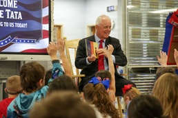 Under Secretary Anthony J. Tata Reads "Lil’ Marine" to Excited First-Graders at DoWEA Americas Crossroads Elementary School